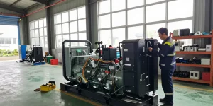 Diesel genset being inspected in a bright industrial warehouse, showcasing power generation operations